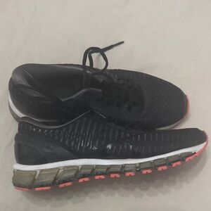 Black and orange woman’s Running Shoes